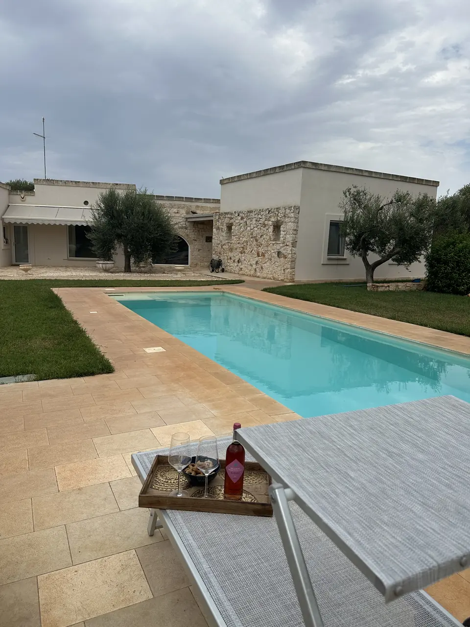 The private pool by day, with the villa behind