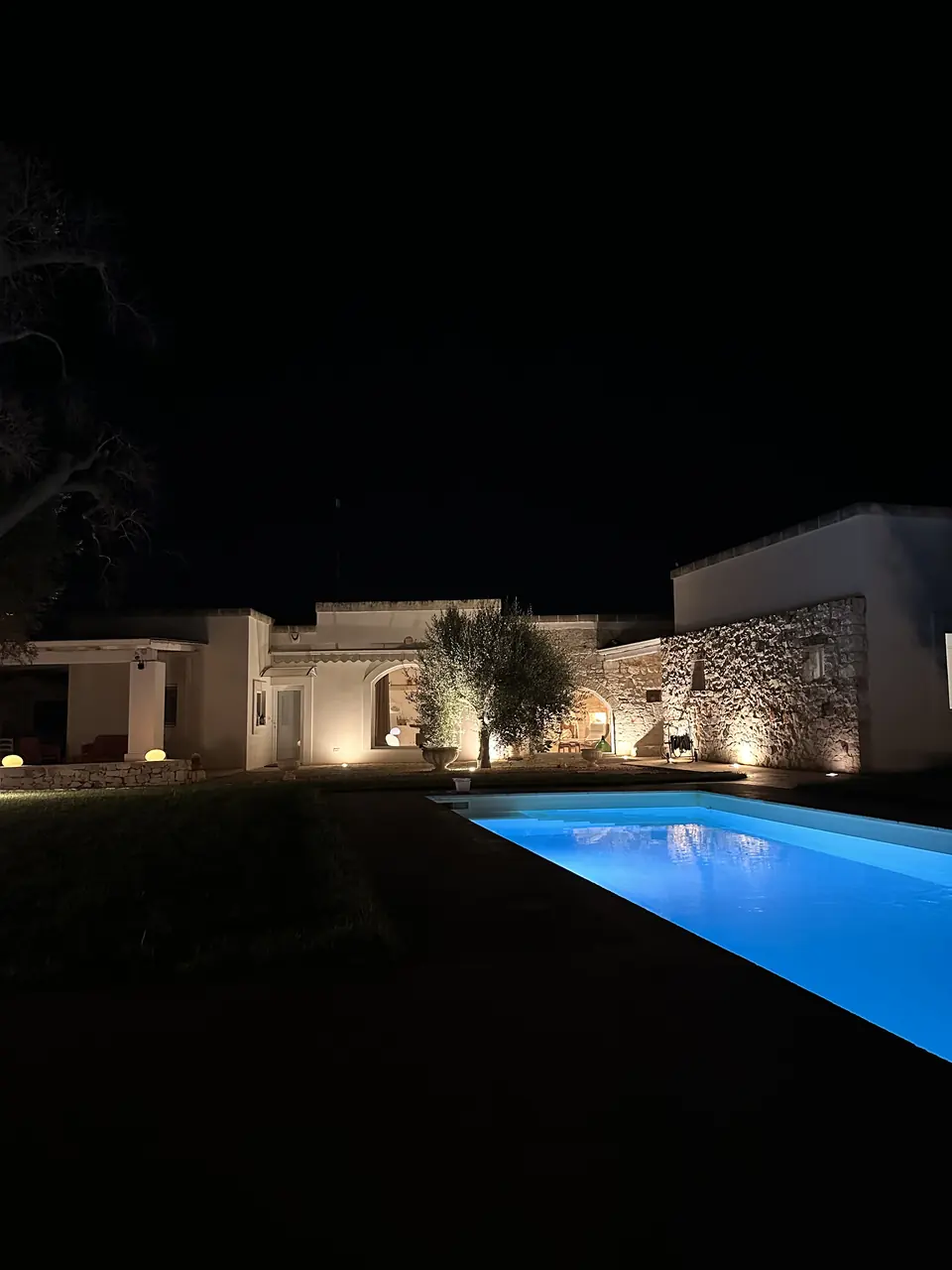 The villa and the private pool at night
